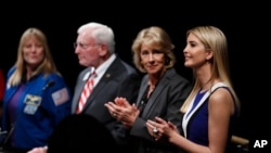 From right, Ivanka Trump, Education Secretary Betsy DeVos, John R. "Jack" Dailey, director of the National Air and Space Museum and NASA Astronaut Kay Hire, applaud at the Smithsonian's National Air and Space Museum in Washington, Tuesday, March 28, 2017, during an event to celebrate Women's History Month.