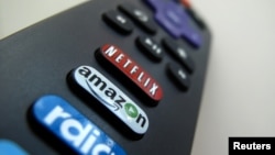 The Amazon TV button on a remote control is shown in this photo illustration, Nov. 10, 2017 