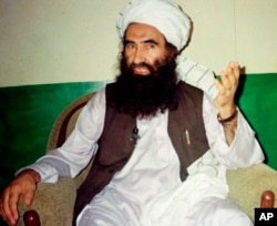 FILE - Jalaluddin Haqqani, founder of the militant group the Haqqani network, speaks during an interview in Miram Shah, Pakistan, Aug. 22, 1998. Taliban say the Afghan Haqqani network founder, an ex- U.S. ally turned fierce enemy, has died.