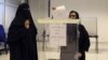 Saudi women vote during the country's municipal elections in Riyadh, Saudi Arabia, Dec. 12, 2015. Saudi women are heading to polling stations across the kingdom on Saturday, both as voters and candidates for the first time.