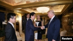 Japan's Prime Minister Shinzo Abe meets with U.S. President-elect Donald Trump (R) at Trump Tower in Manhattan, New York, U.S., Nov. 17, 2016.
