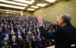 Turkish President Recep Tayyip Erdogan addresses the heads of villages at his palace in Ankara, Turkey, Monday, Oct. 26, 2015.