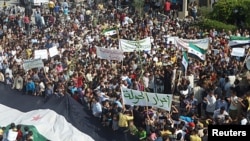 Demonstrators protest against Syria's President Bashar al-Assad in Hula, near Homs, October 27, 2011.