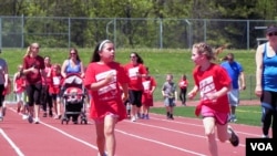 Students at Bermudian Springs school run on the track. The school is proud of its diversity, and staff members say they have worked successfully to integrate their minority students. (M. Kornely/VOA)