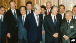 Foreign ministers attending the Paris Peace Conference on Cambodia pose prior to the meeting, Oct. 23, 1991. Front row L-R: United Nations Secretary General Javier Perez de Cuellar, Roland Dumas of France, Cambodia's Prince Norodom Sihanouk, back row L-R: unidentified, U.S. Secretary of State James Baker, Qian Qichen of China, Soviet Union's Boris Pankin, Burnei's Prince Mohamed Bolkiah, Great Britain's Lord Caithness, unidentified, Thailand's Anan Sarasin. (AP Photo)