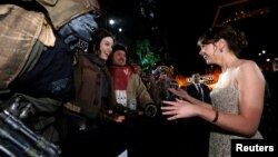 FILE - Actress Felicity Jones chats with fans as she arrives at the world premiere of the film "Rogue One: A Star Wars Story" in Hollywood, California, U.S., Dec. 10, 2016. 