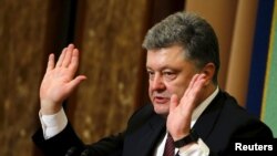 FILE - Ukraine's President Petro Poroshenko, shown at a news conference at the Japan National Press Club in Tokyo in April, seeks reassurance of continued U.S. support against Russia. 