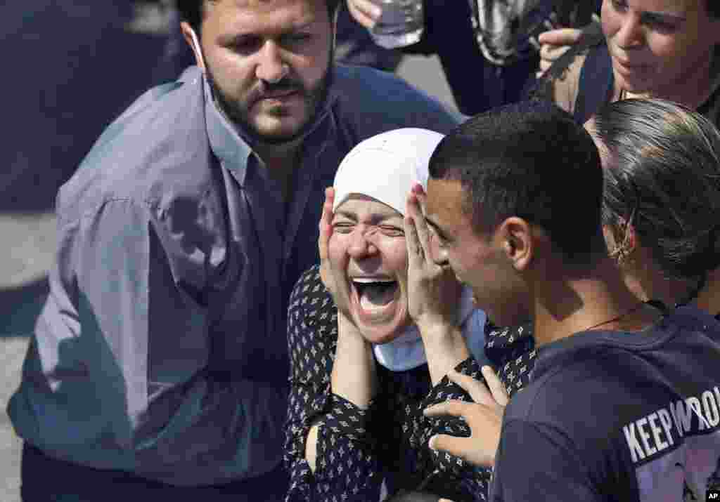 The wife of Rami Kaaki, one of ten firefighters who were killed during the last week&#39;s explosion that hit the seaport of Beirut, Lebanon, mourns during her husband&#39;s funeral at the firefighter headquarters.