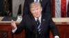 President Donald Trump gestures toward Democrats while addressing a joint session of Congress on Capitol Hill in Washington, Feb. 28, 2017.