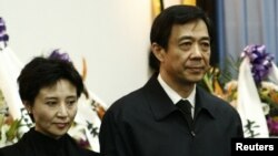 China's former Chongqing Municipality Communist Party Secretary Bo Xilai (R) and his wife Gu Kailai.