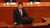 中国国家主席习近平在北京人民大会堂举行的解放军建军90周年大会上发表讲话 (2017年8月1日)。后面第一排左起：孙春兰、刘奇葆、王沪宁、张高丽