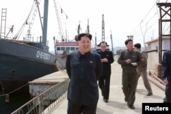 FILE - North Korean leader Kim Jong Un provides field guidance at the Sinpho Pelagic Fishery Complex, in this undated photo released by North Korea's Korean Central News Agency (KCNA) in Pyongyang on May 9, 2015.