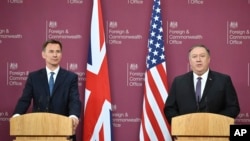 U.S. Secretary of State Mike Pompeo, right, and Britain's Foreign Secretary Jeremy Hunt speak at a joint press conference at the Foreign Office in London, May 8, 2019.