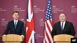 U.S. Secretary of State Mike Pompeo, right, and Britain's Foreign Secretary Jeremy Hunt speak at a joint press conference at the Foreign Office in London, May 8, 2019.