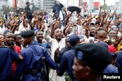 Supporters of Felix Tshisekedi, leader of the Congolese main opposition party, the Union for Democracy and Social Progress who was announced as the winner of the presidential elections, celebrate in the streets of Kinshasa, Democratic Republic of Congo, Jan. 10, 2019.