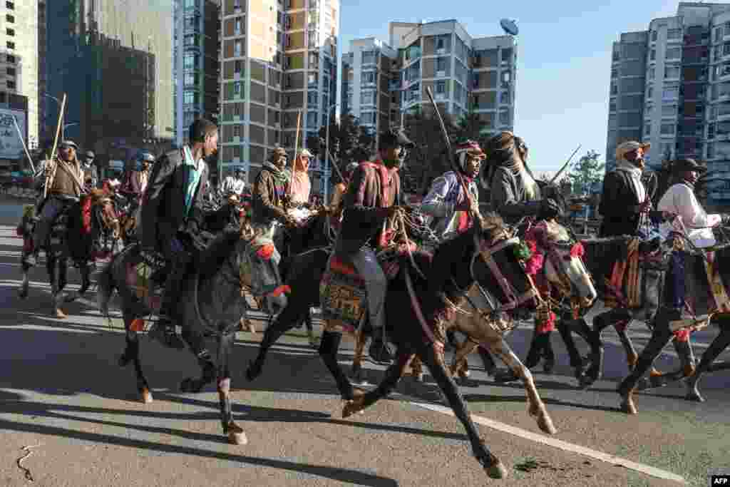 Horsemen go to the airport as they prepare to welcome Ethiopian Prime Minister Abiy Ahmed on his return from the Peace Nobel Prize ceremony, in Addis Ababa.
