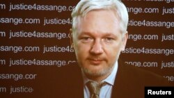 FILE - WikiLeaks founder Julian Assange appears via video link at a news conference in London, Feb. 5, 2016. A Swedish appeals court has upheld a warrant for his arrest.