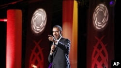 President Barack Obama speaks at a luau and entertainment portion of the leaders dinner at the APEC Summit in Honolulu, Hawaii, November 12, 2011.