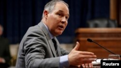 FILE - Scott Pruitt, Environmental Protection Agency administrator, gestures as he testifies to the Senate Environment and Public Works Committee oversight hearing on Capitol Hill in Washington, Jan. 30, 2018. 
