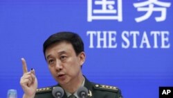 Defense Ministry spokesman Wu Qian speaks during a press conference at the State Council Information Office in Beijing, Wednesday, July 24, 2019. 