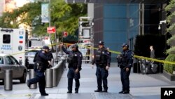 New York City Police Dept. officers arrive outside the Time Warner Center, in New York, Oct. 24, 2018. A police bomb squad was sent to CNN's offices in New York City and the newsroom was evacuated because of a suspicious package.