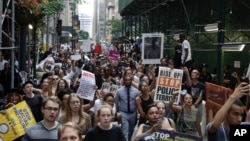 A large group of protesters march in New York City, reacting to recent police-related shootings of two black men in Minnesota and Louisiana, July 7, 2016.