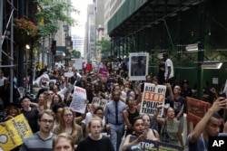 A large group of protesters march in New York City, reacting to recent police-related shootings of two black men in Minnesota and Louisiana, July 7, 2016.