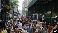 A large group of protesters march in New York City, reacting to recent police-related shootings of two black men in Minnesota and Louisiana, July 7, 2016.