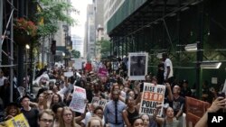 A large group of protesters march in New York City, reacting to recent police-related shootings of two black men in Minnesota and Louisiana, July 7, 2016.