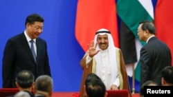 Chinese President Xi Jinping and Kuwait's Emir Sheikh Sabah Al-Ahmad Al- Jaber Al-Sabah attend a China Arab forum at the Great Hall of the People in Beijing, China, July 10, 2018. 