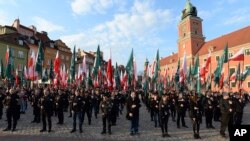 FILE - Members of the National-Radical Camp, a far- right group, mark the 83rd anniversary of their organization, in Warsaw, Poland, April 29, 2017. Warsaw's Jewish community urged the country's most powerful politician to denounce growing anti-Semitism.