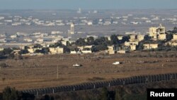 19일 이스라엘 점령지인 골라고원에서 시리아 국경 너머의 모습이 보인다. 