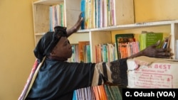 The school library is being stocked. Rebecca hopes the books will help heal the students' troubled minds.