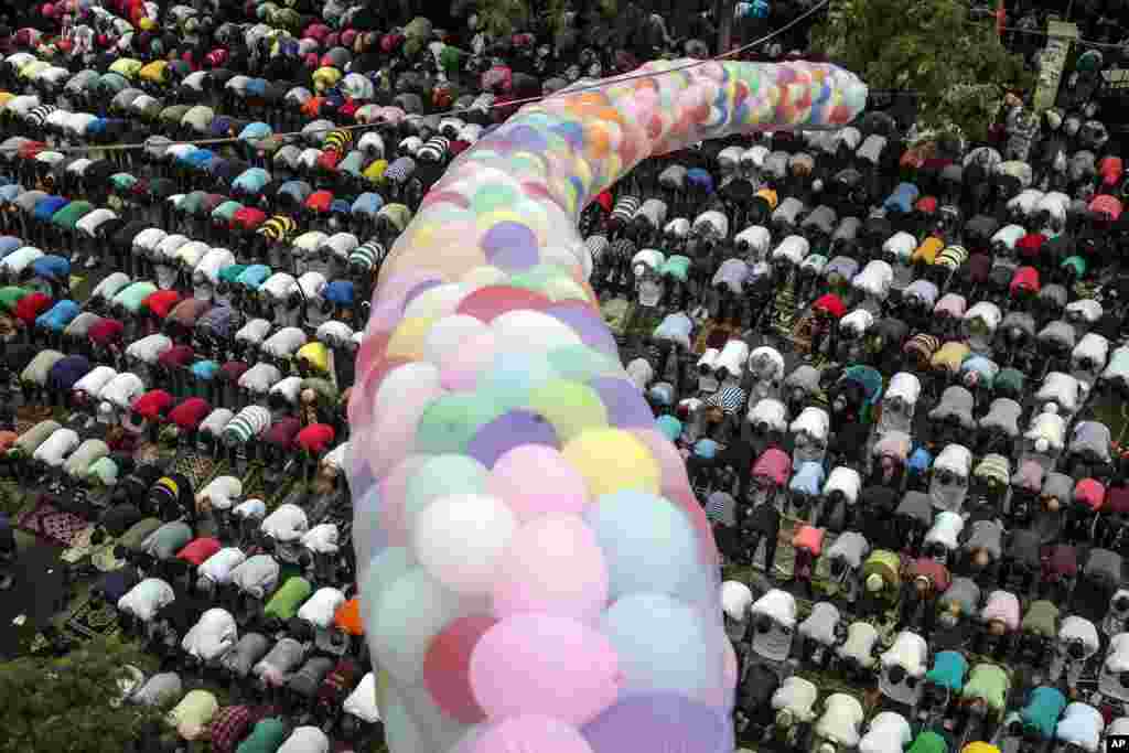 Egyptians take part in Eid Al-Adha prayers at the al-Seddik Mosque in Cairo.