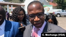 Mthuli Ncube, Zimbabwe’s new finance minister, talking to reporters after taking oath of office in Harare, Sept. 10, 2018. 