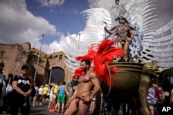 People take part in the annual gay pride parade in Rome, June 9, 2018.