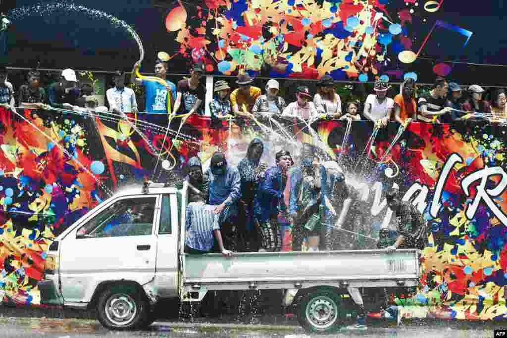 People take part in celebrations marking Thingyan, a water festival which brings in the country's new year, in Yangon, Myanmar. The four southeast Asian nations of Myanmar, Thailand, Cambodia and Laos started the Buddhist new year.