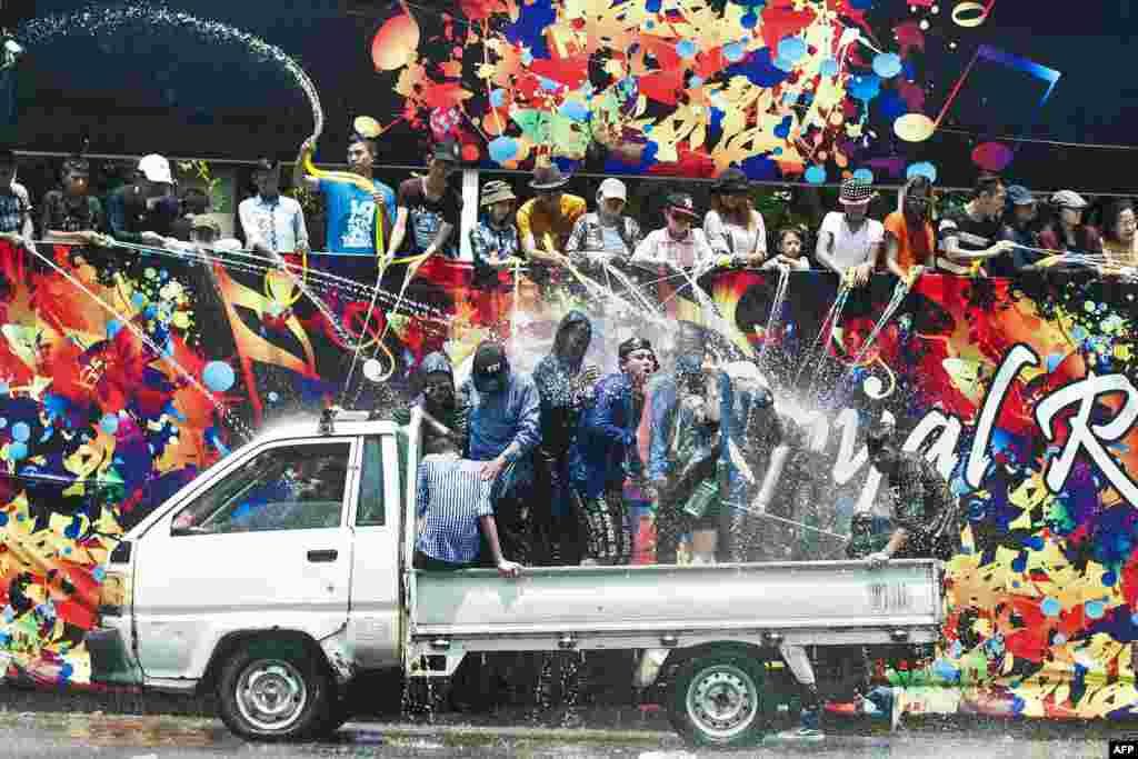 People take part in celebrations marking Thingyan, a water festival which brings in the country&#39;s new year, in Yangon, Myanmar. The four southeast Asian nations of Myanmar, Thailand, Cambodia and Laos started the Buddhist new year.