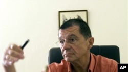Marcel Lemonde, co-investigating judge for the Khmer Rouge tribunal, gestures during an interview with the Associated Press at his office in Phnom Penh, Cambodia in 2007. 