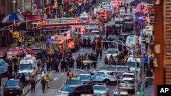 Law enforcement officials work following an explosion near New York's Times Square, Dec. 11, 2017.
