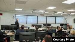 SparkCognition’s Sam Septembre presents at the Defense Intelligence Agency iHub August 2, 2017. (Courtesy DIA)