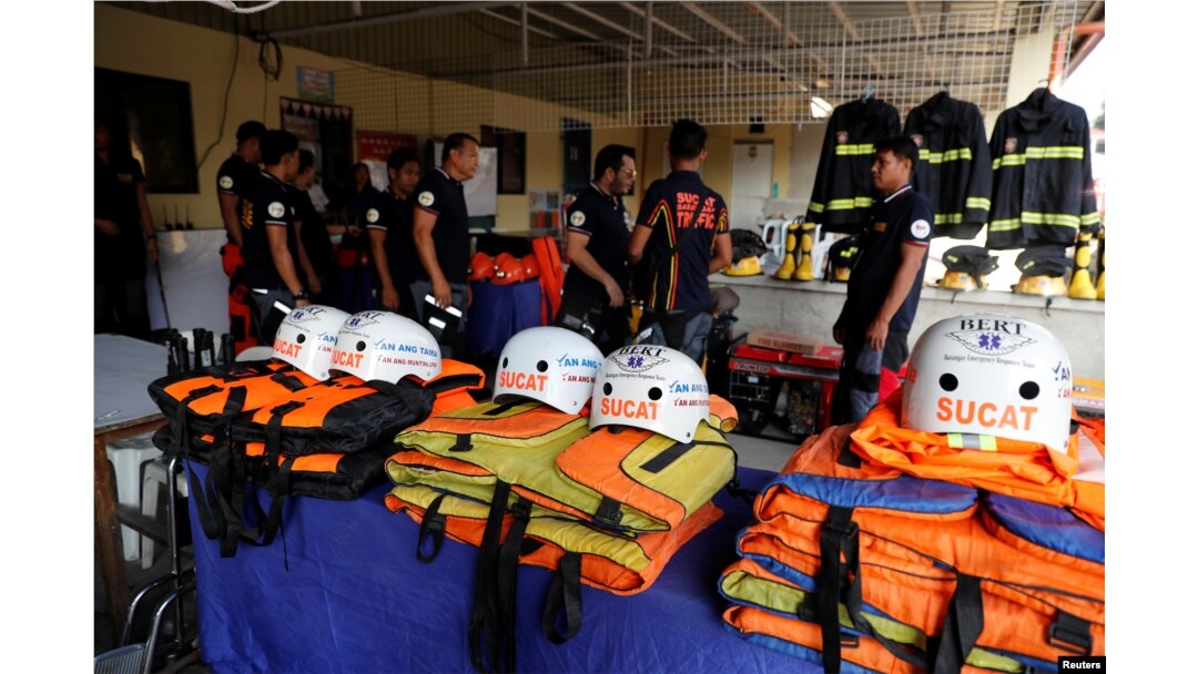 Rescuers ready their gear before Super Typhoon Mangkhut hits the main island of Luzon, in Muntinlupa, Metro Manila, Philippines, Sept. 13, 2018.