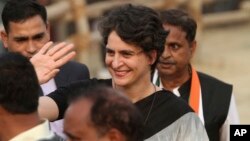FILE - Priyanka Gandhi Vadra, daughter of Congress party President Sonia Gandhi, waves to party supporters during an election campaign rally in Rae Barelli in the northern Indian state of Uttar Pradesh, India, Feb. 16, 2017.
