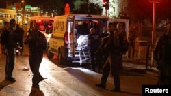 Israeli emergency personnel carry the body of one of three Palestinians who carried out shooting and stabbing attacks that fatally injured an Israeli border policewoman outside Damascus gate to Jerusalem's Old City June 16, 2017.