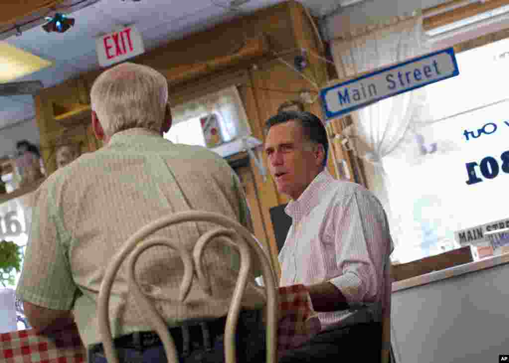 Republican presidential candidate, former Massachusetts Gov. Mitt Romney meets with local business leaders and farmers during a campaign stop in Council Bluffs, Iowa, June 8, 2012.