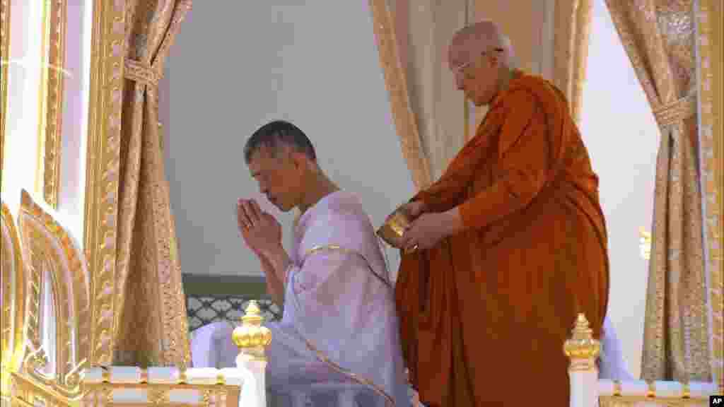 Thailand’s King Maha Vajiralongkorn, left, attends the royal purification ceremony at the Grand Palace, May 4, 2019, in Bangkok. Saturday began three days of elaborate centuries-old ceremonies for the formal coronation of Vajiralongkorn.