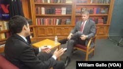 Ayub Khawreen, left, of VOA's Afghan service interviews Blackwater founder Erik Prince about his controversial proposal to privatize a large portion of the U.S. war in Afghanistan.