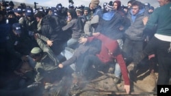 Israeli police clash with settlers in the West Bank outpost of Amona, Feb. 1, 2017. Israeli forces have begun evacuating a controversial settlement erected in the West Bank without permission but generally tolerated by the Israeli government. 