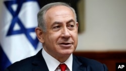 FILE - Israeli Prime Minister Benjamin Netanyahu attends the weekly cabinet meeting in Jerusalem, Jan. 22, 2017. 