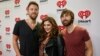 FILE - Lady Antebellum's Charles Kelley, Hillary Scott and Dave Haywood, from left, arrive at the iHeartRadio Country Festival in Austin, Texas, March 29, 2014.